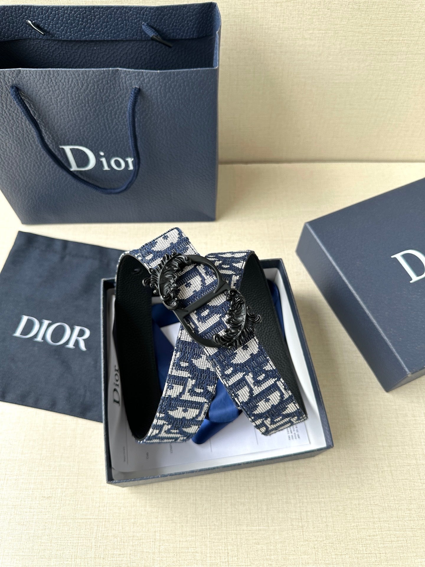Dior belt detail with blue-and-white monogram fabric and black buckle