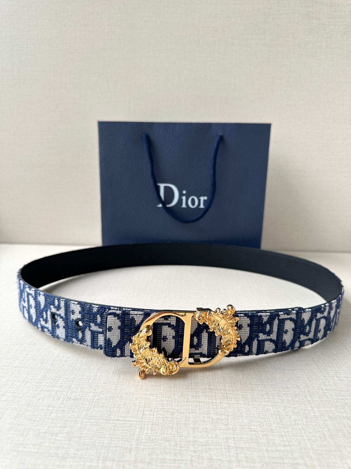 Dior belt in navy and light blue logo canvas with gold-tone buckle and clasp