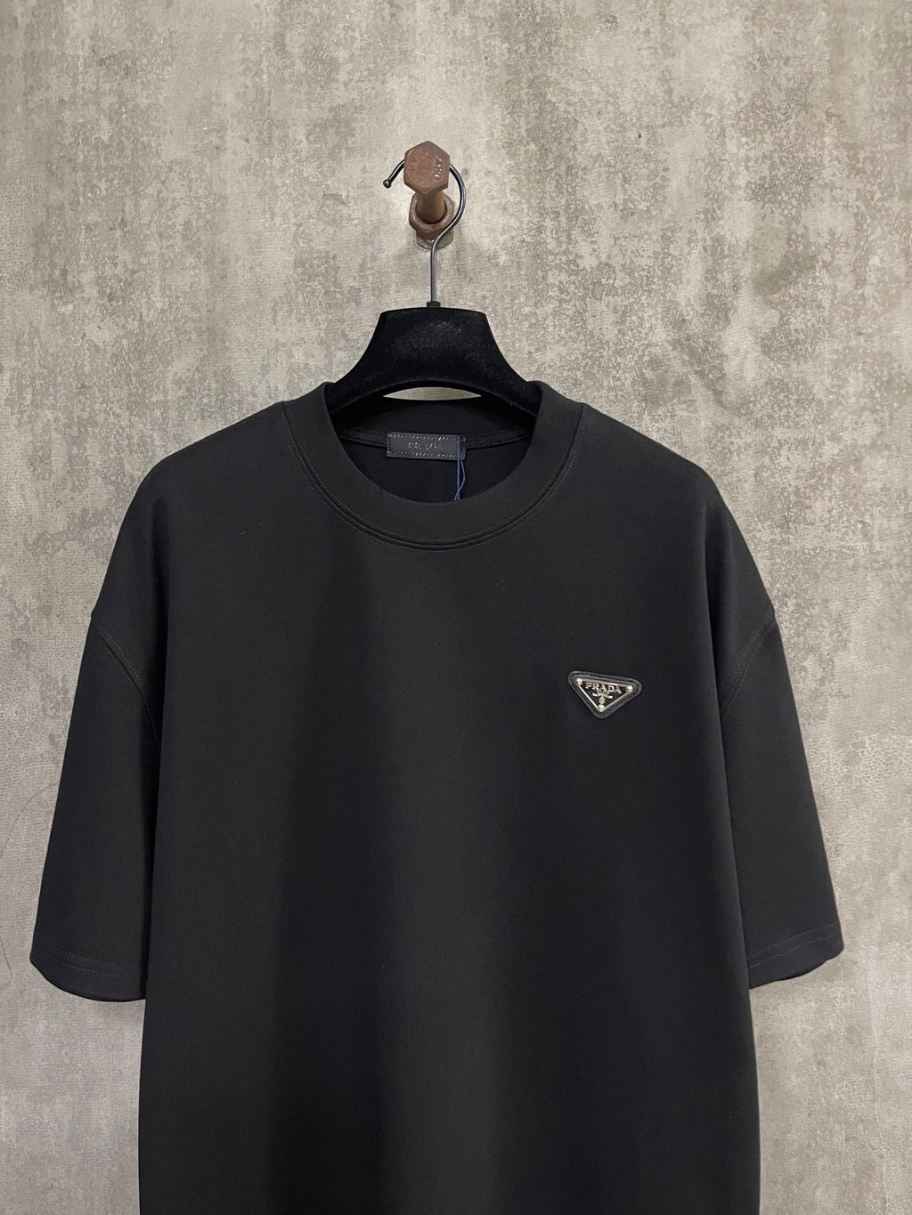 Black short-sleeve T-shirt with small Prada triangle logo