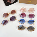 Set of round sunglasses with rose and gold frames, tinted lenses, jeweled temple details