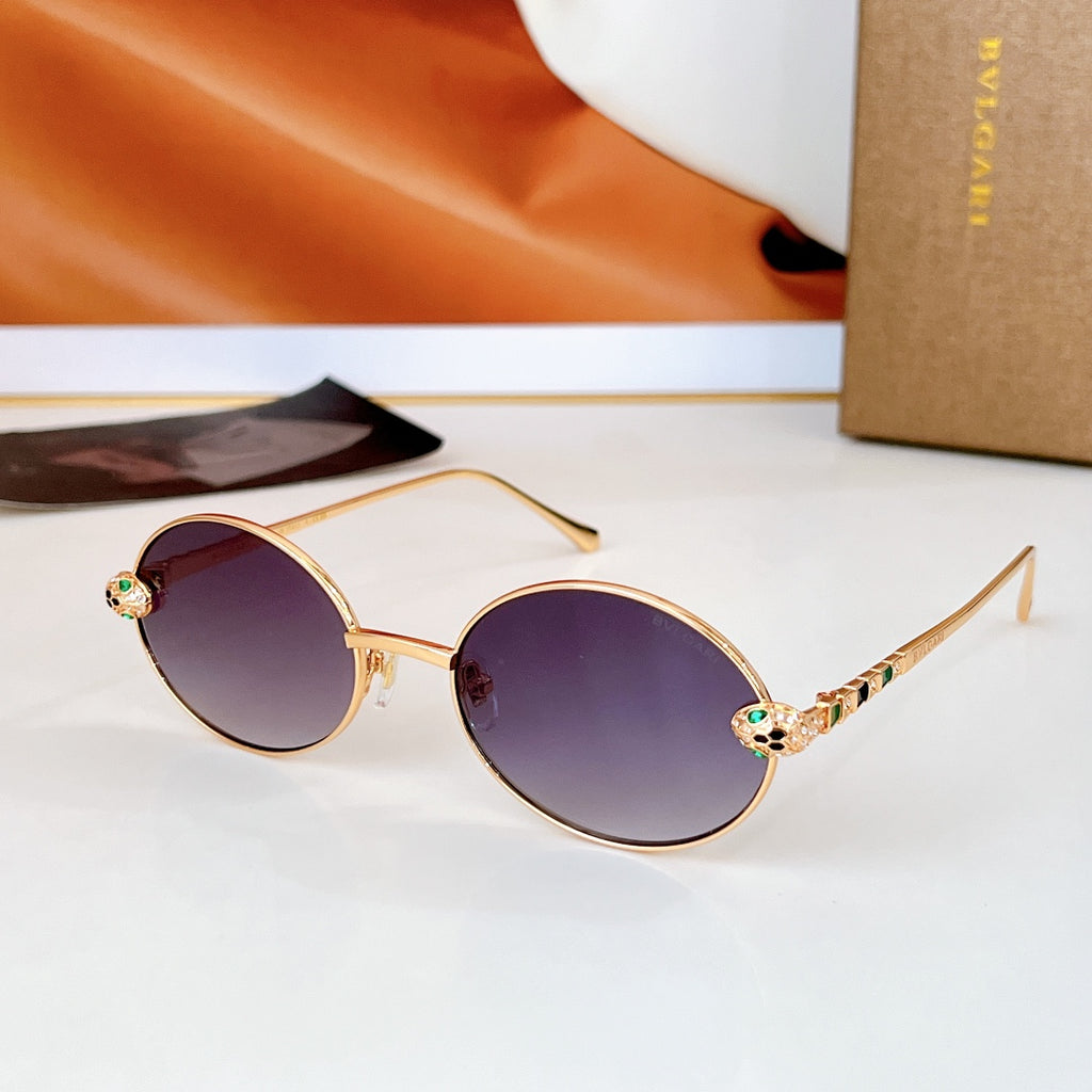 Gold round sunglasses with dark purple lenses and colorful jeweled temple details