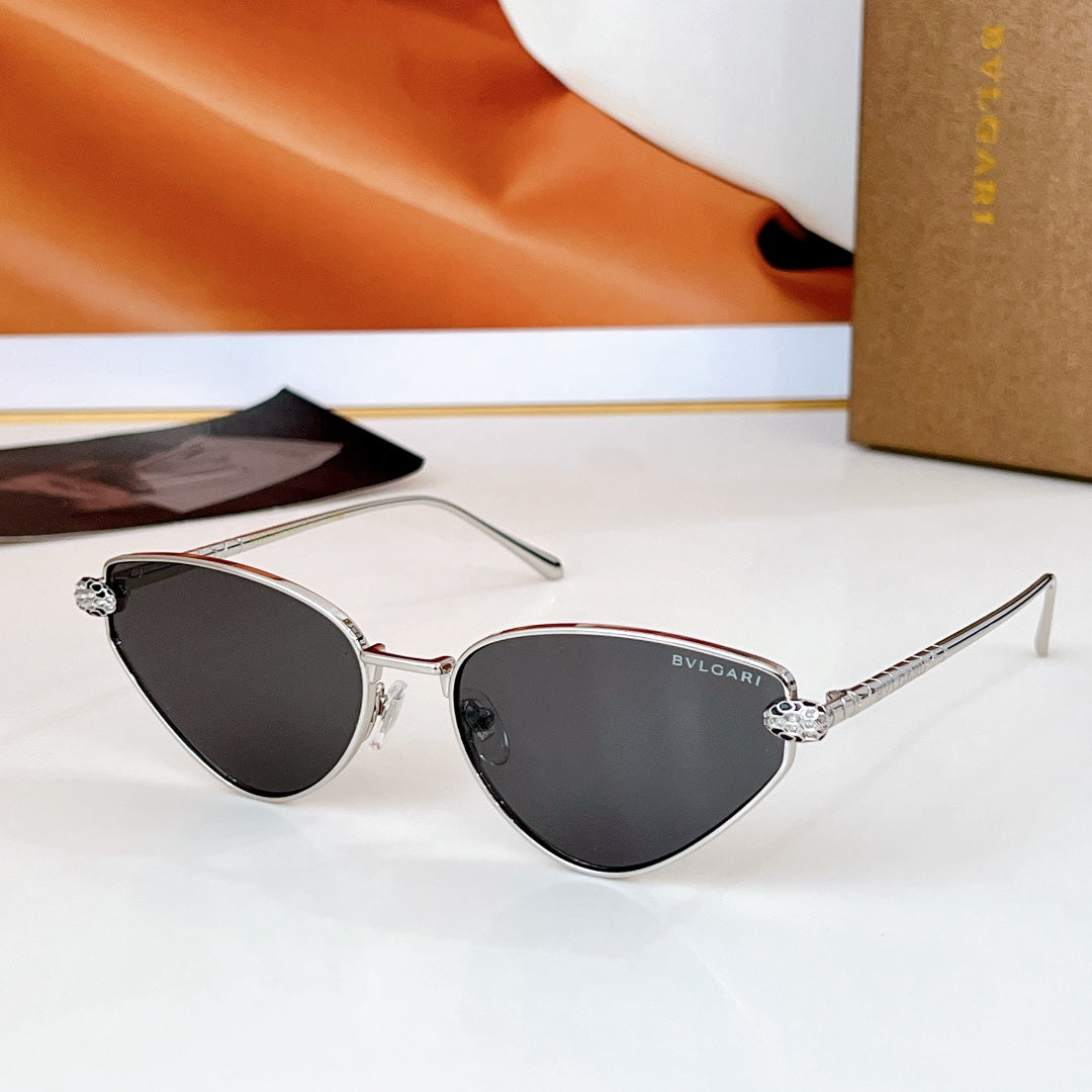 Cat-eye sunglasses with silver-tone frame, dark lenses, Bvlgari logo on temple