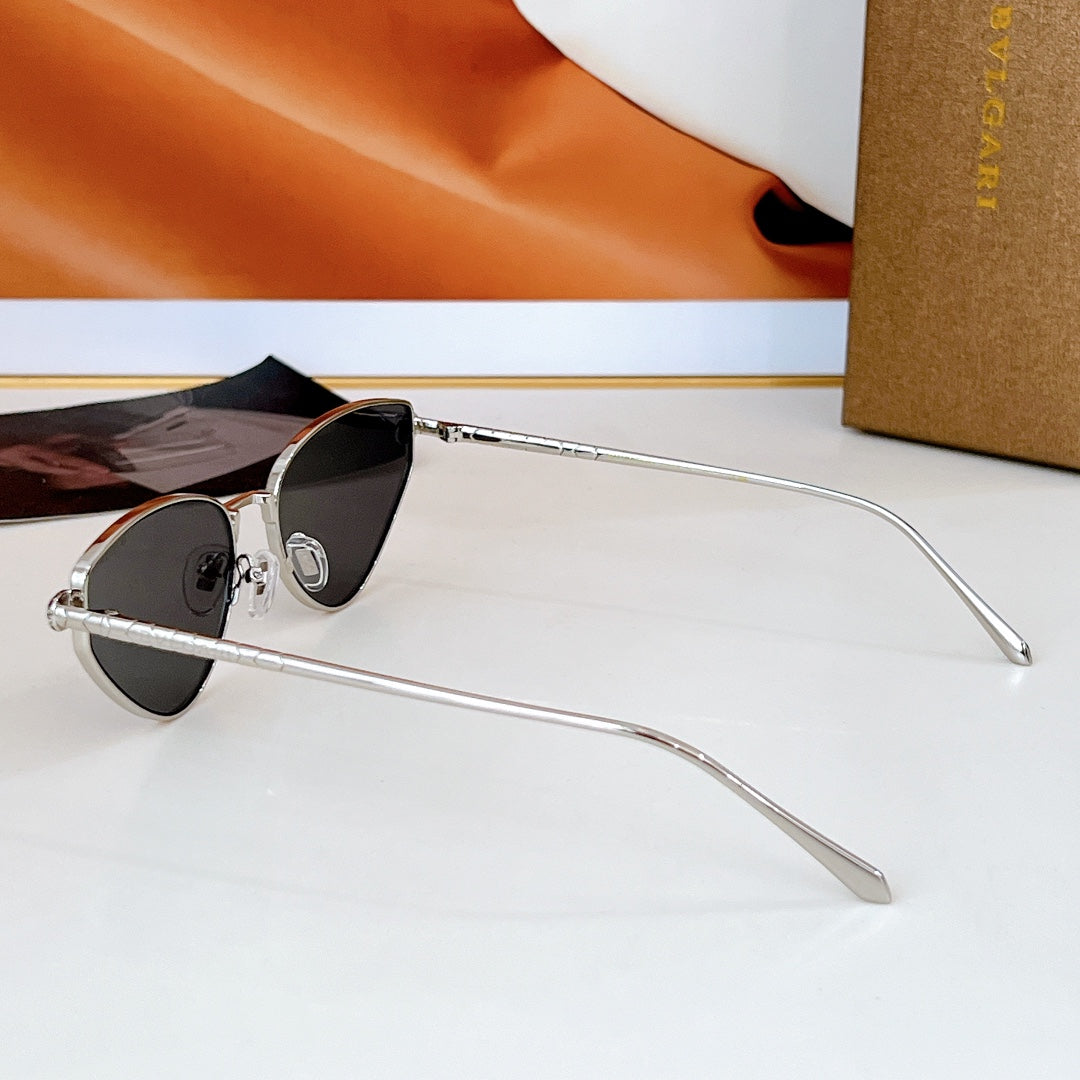 Cat-eye sunglasses with silver-tone frame and black gradient lenses
