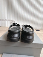 Balenciaga black sandals with back view showing molded heel and strap detail
