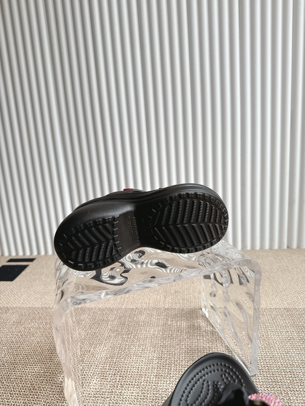 Balenciaga black sandals with textured outsole tread, rear view