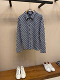 Navy and white patterned long-sleeve shirt on hanger