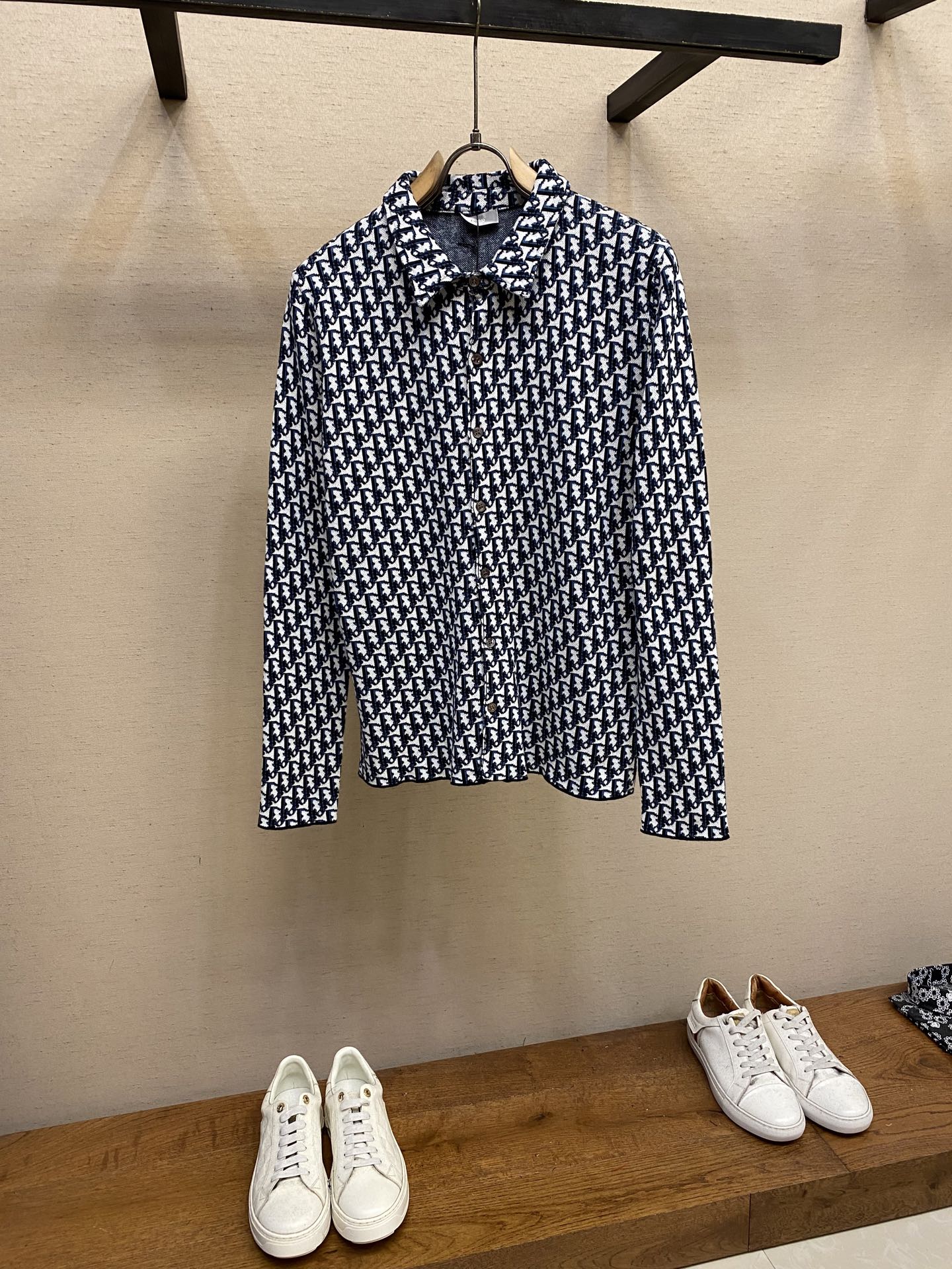 Navy and white patterned long-sleeve shirt on hanger