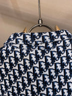 Navy and white patterned shirt back yoke on hanger