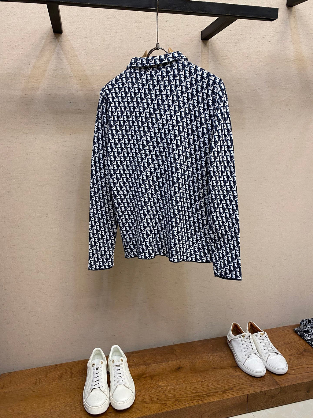 Navy and white patterned long-sleeve shirt, back view on hanger