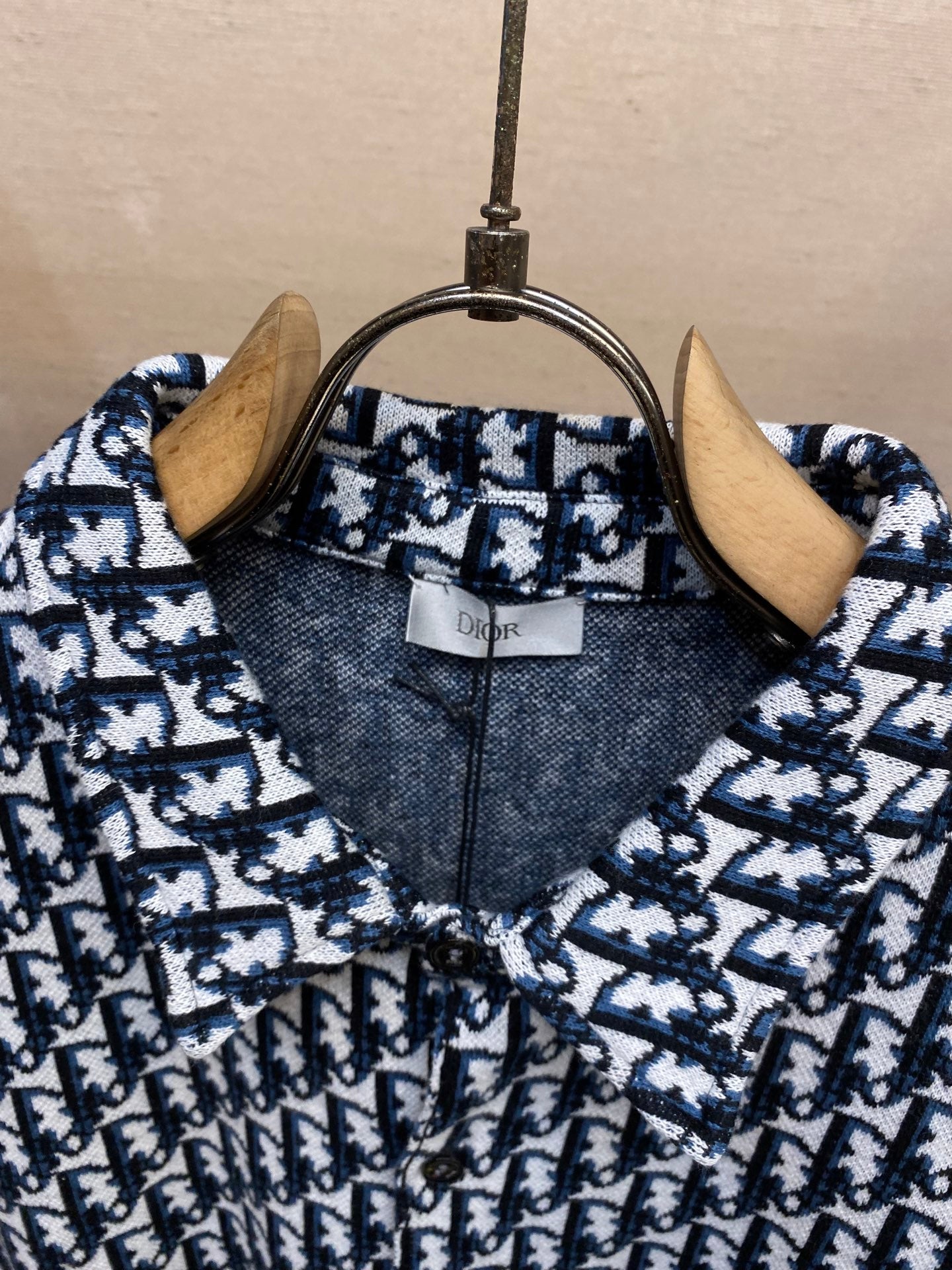 Navy and white patterned shirt collar with Dior label
