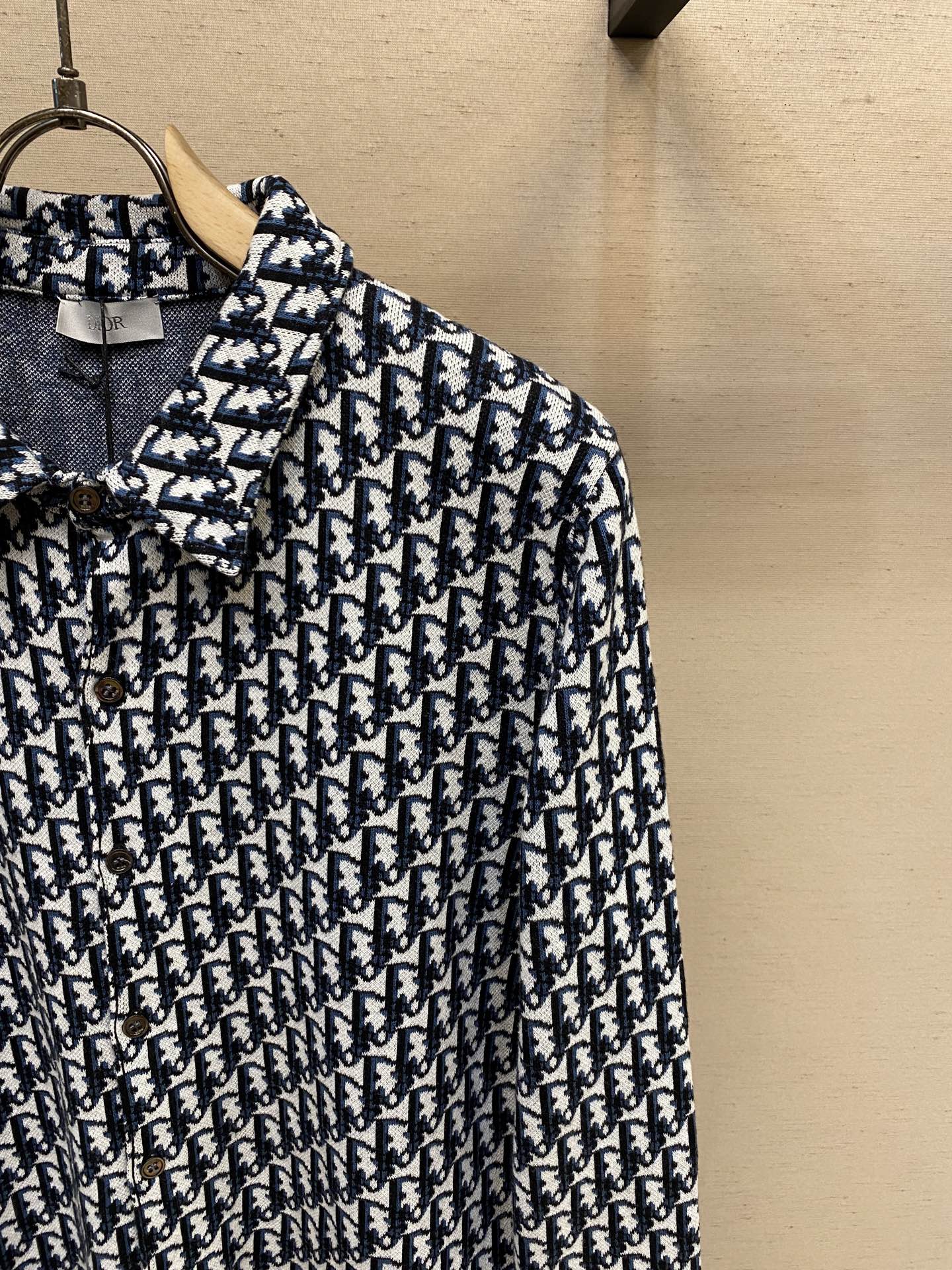 Navy and white patterned long-sleeve shirt with button placket