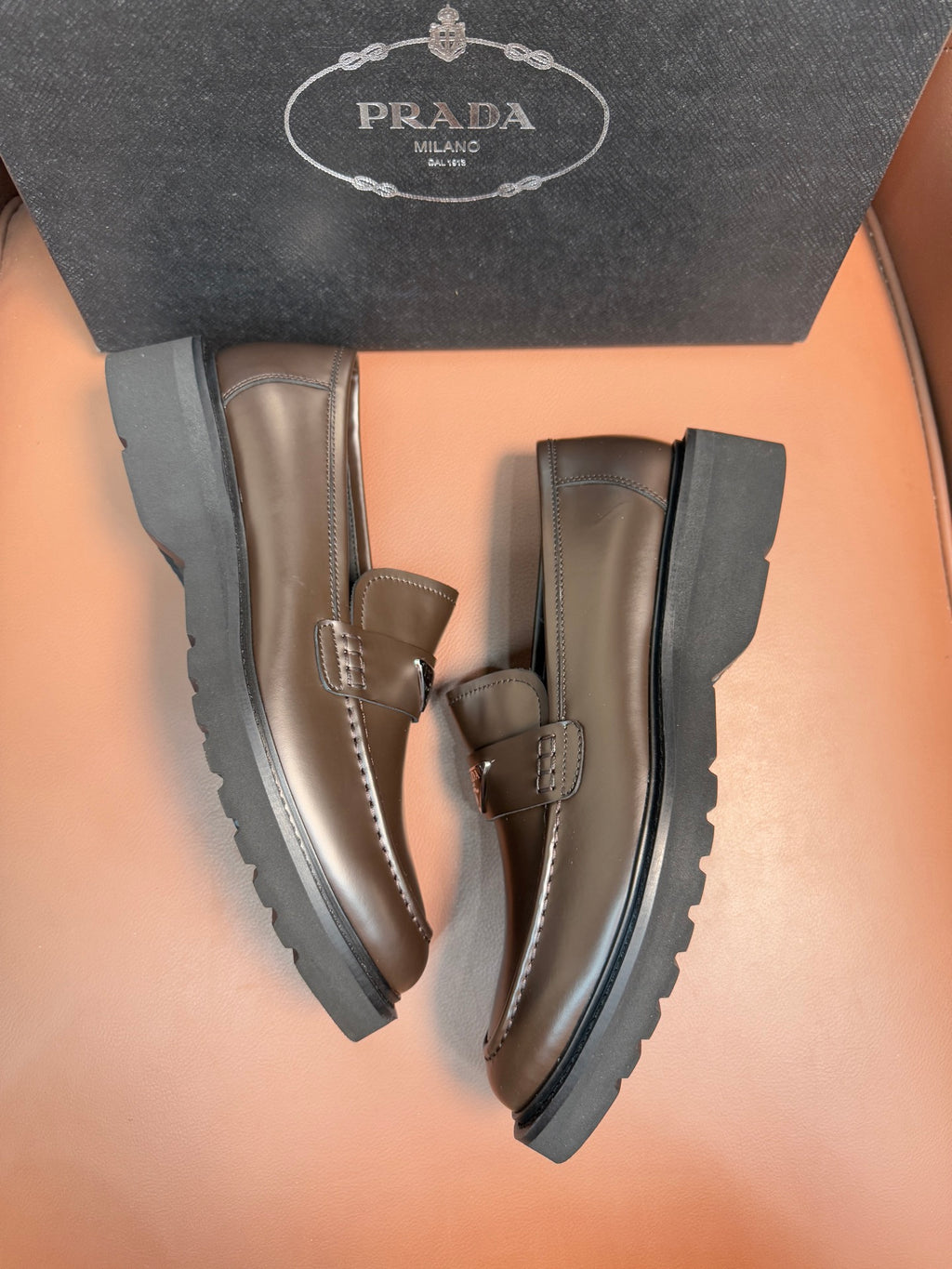 Prada unisex loafers with dark metallic brown leather uppers, stacked platform sole