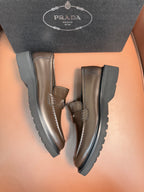 Prada unisex loafers with dark metallic brown leather uppers, stacked platform sole