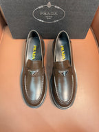 Prada unisex loafers in dark metallic brown leather, stitched apron and moc-style seams
