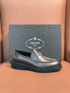 Prada unisex loafers in dark metallic brown leather, front detail with moc stitching