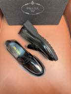 Prada unisex loafers, side view in dark metallic leather with strap and low profile