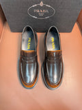 Dark metallic leather loafer with apron strap, stitched moc toe, chunky rubber sole