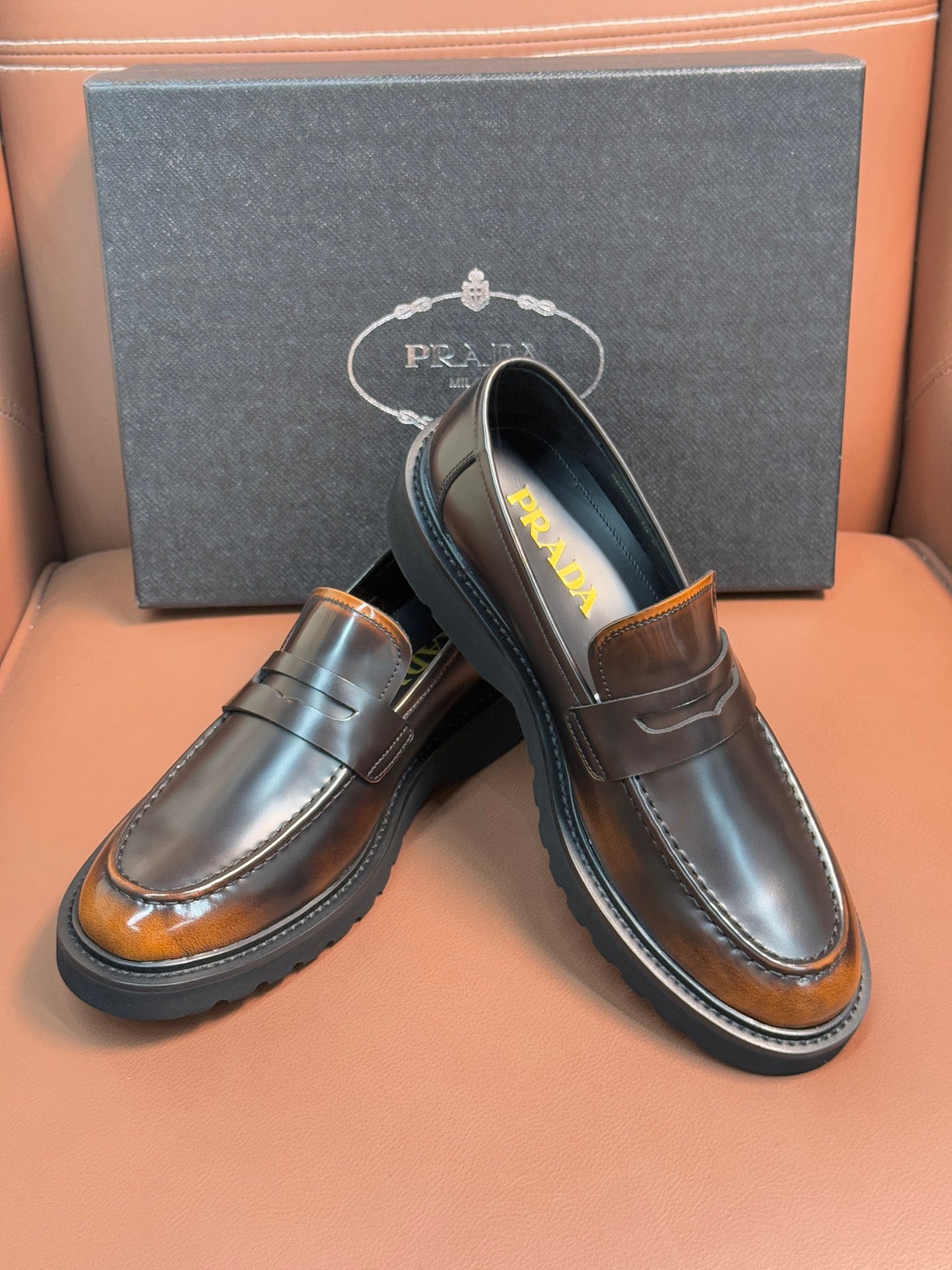 Dark metallic slip-on loafers with apron strap, stitched moc toe, cushioned sole