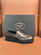 Metallic brown loafer with penny strap, stitched apron, black rubber sole