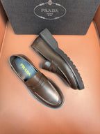 Metallic brown loafers, side profile with strap detail and contrast sole edge