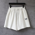 Balenciaga white shorts with elastic waistband and crest logo on side