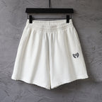 Balenciaga white shorts with elastic waistband and crest logo on side
