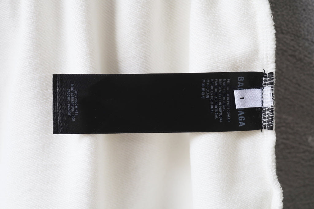 Balenciaga white shorts with white label tag on inner hem