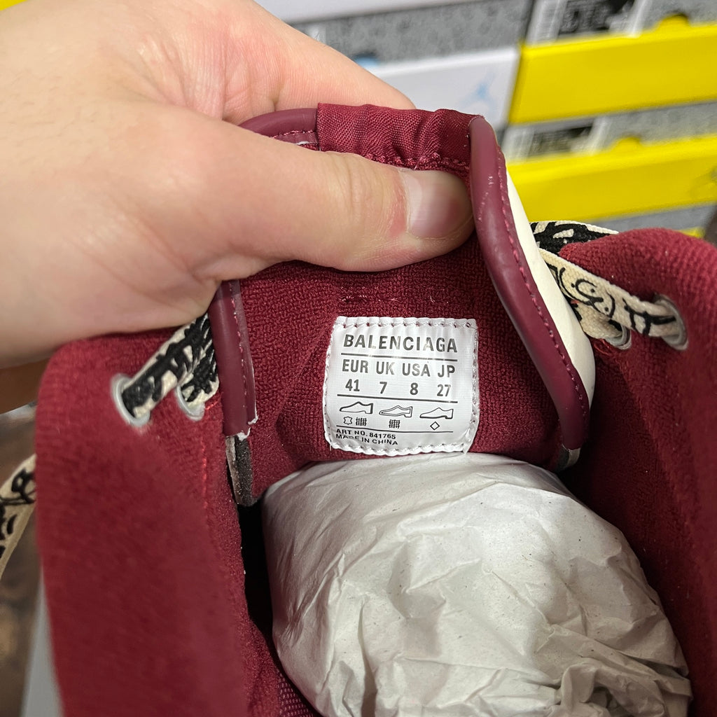 Inside tag of white Balenciaga sneaker with maroon lining; size and E U K U S A J P info