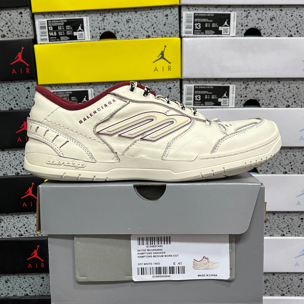White Balenciaga low-top sneaker on box, maroon interior lining, lace-up design