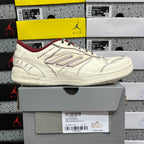White Balenciaga low-top sneaker on box, maroon interior lining, lace-up design
