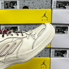 White Balenciaga sneaker side view with maroon trim, quilted stitching, and chunky sole