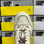 White Balenciaga sneaker tongue and laces, maroon accents, close-up top view