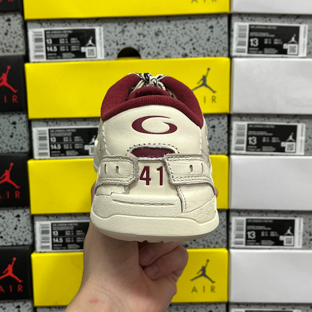 White Balenciaga sneaker heel with maroon collar, number patch 41 on back