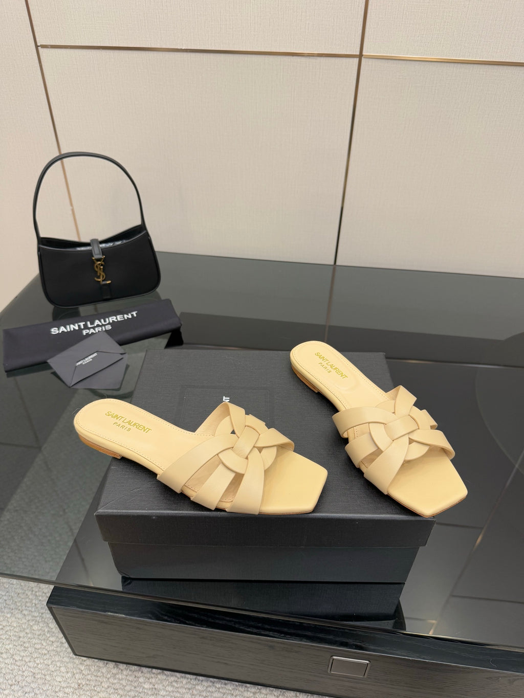 Women’s beige slide sandals with braided cross straps and footbed