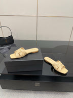 Women’s beige slide sandals, two angles on box