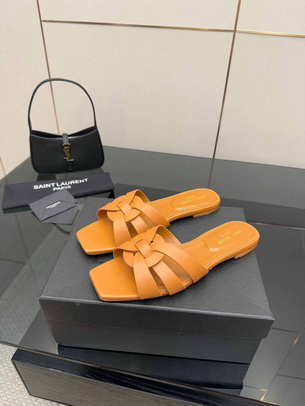 YSL women's orange woven slide sandals, crossover straps and flat slip-on design