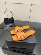 YSL women's orange woven slide sandals, crossover straps and flat slip-on design