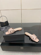 Women's light beige braided slide sandals with low, flat slide heel