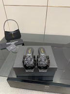 Black slide sandals with patent straps and metallic studded buckle detailing