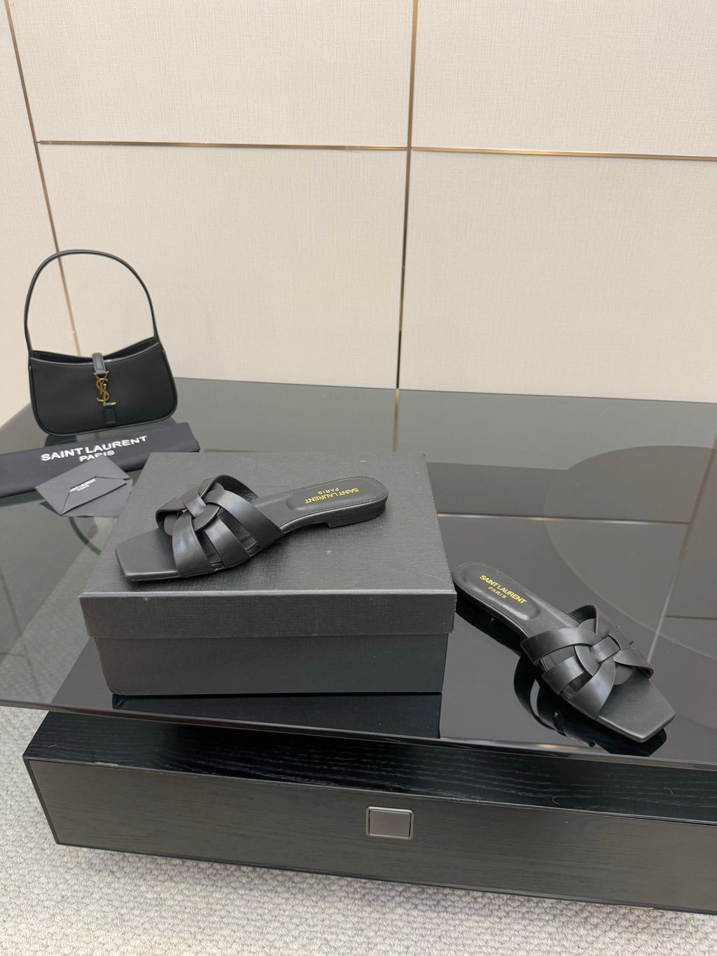 YSL ladies' slide sandals on box: dark braided straps, low flat outsole