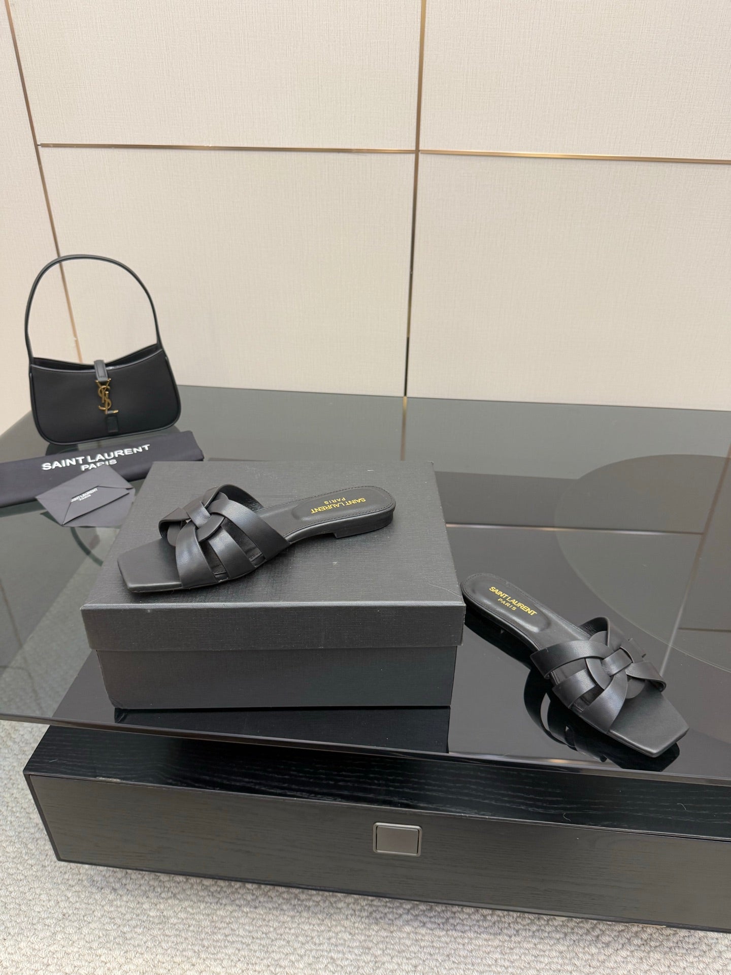 YSL ladies' slide sandals on box: dark braided straps, low flat outsole