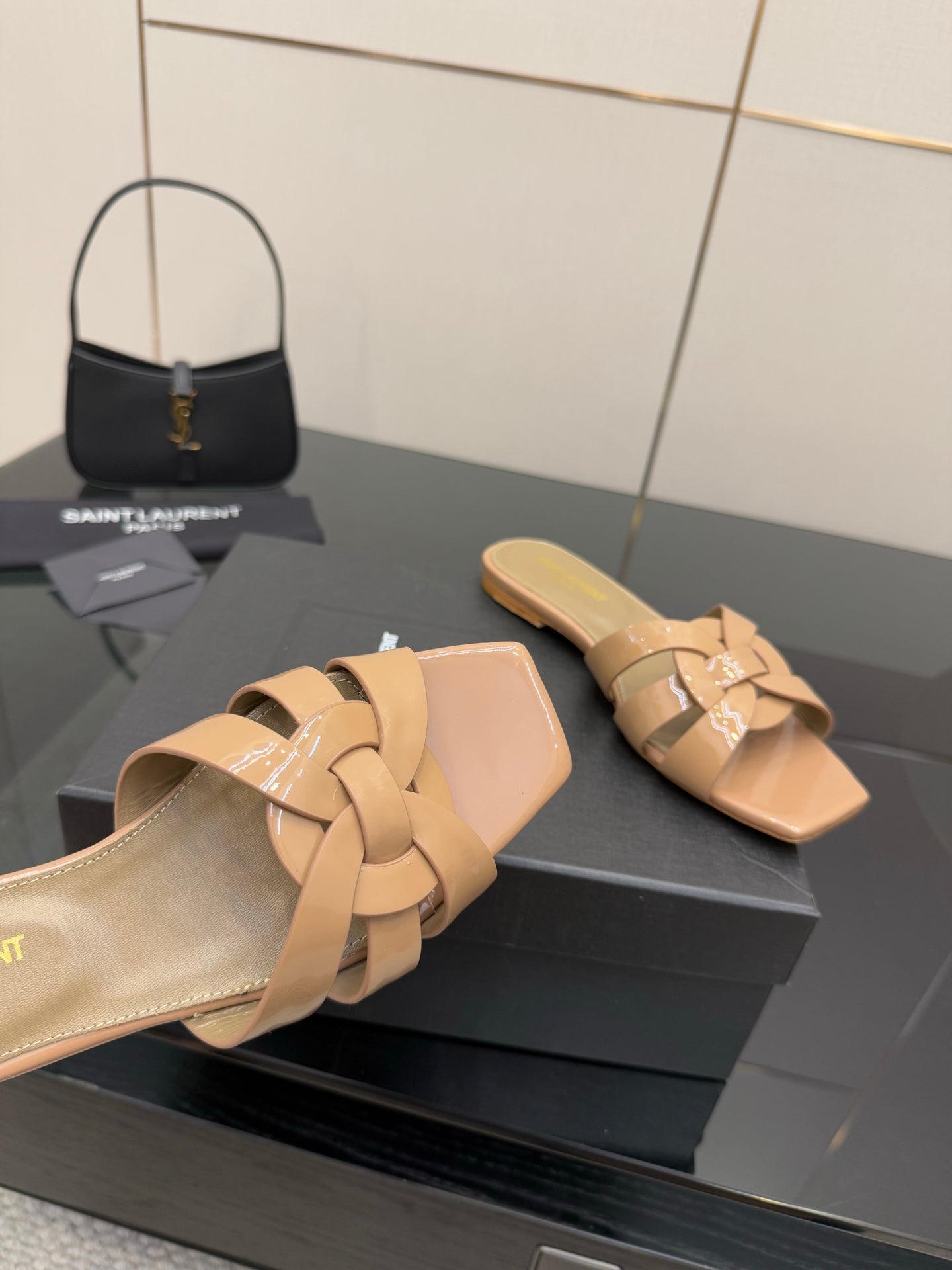 YSL ladies slide sandals close-up, beige woven crossover straps, open toe