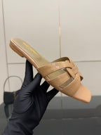 YSL ladies sandal on hand, beige strappy slide with woven crossover, low heel