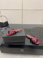 YSL pink bow mules, open-toe slide sandals with glossy strap bows shown on box