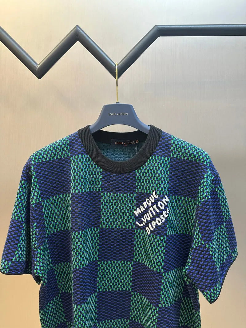 Blue and green check short-sleeve top with white logo and black crew neck
