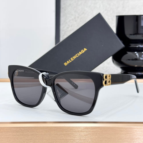 Balenciaga sunglasses with dark lenses, black frames, and gold B logo accent