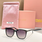 MiuMiu sunglasses with black frame and dark lenses, with pink storage pouch