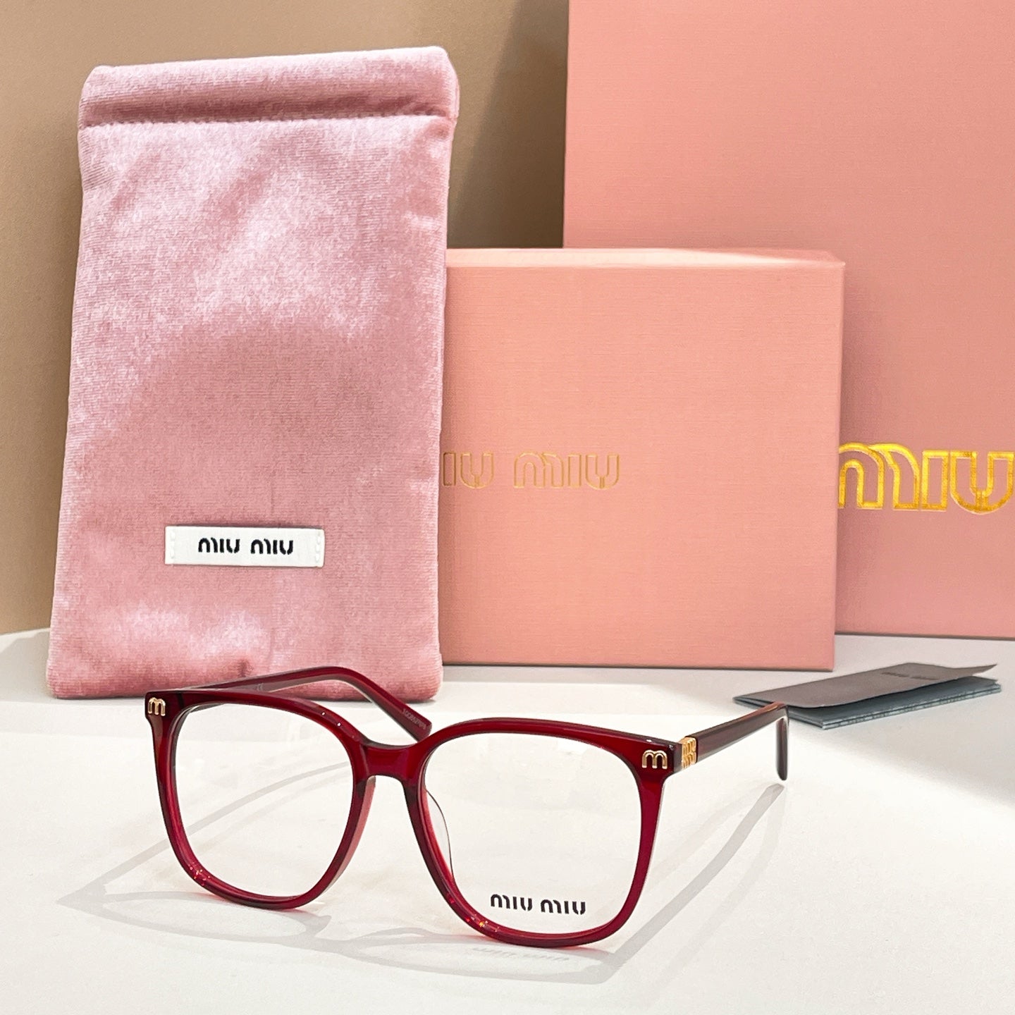 Burgundy full-rim eyeglasses with pink velvet pouch and case