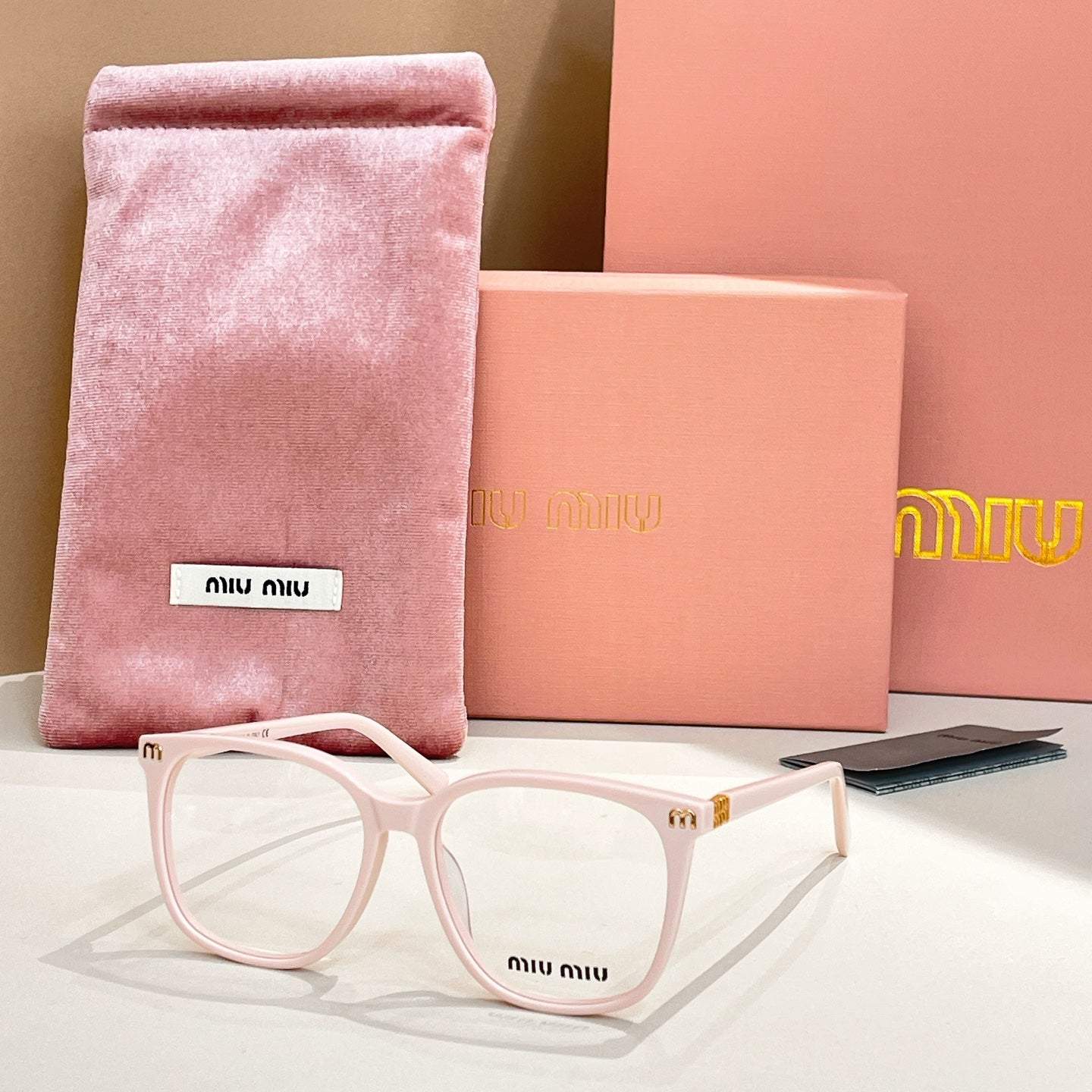 White full-rim eyeglasses with pink velvet pouch and case