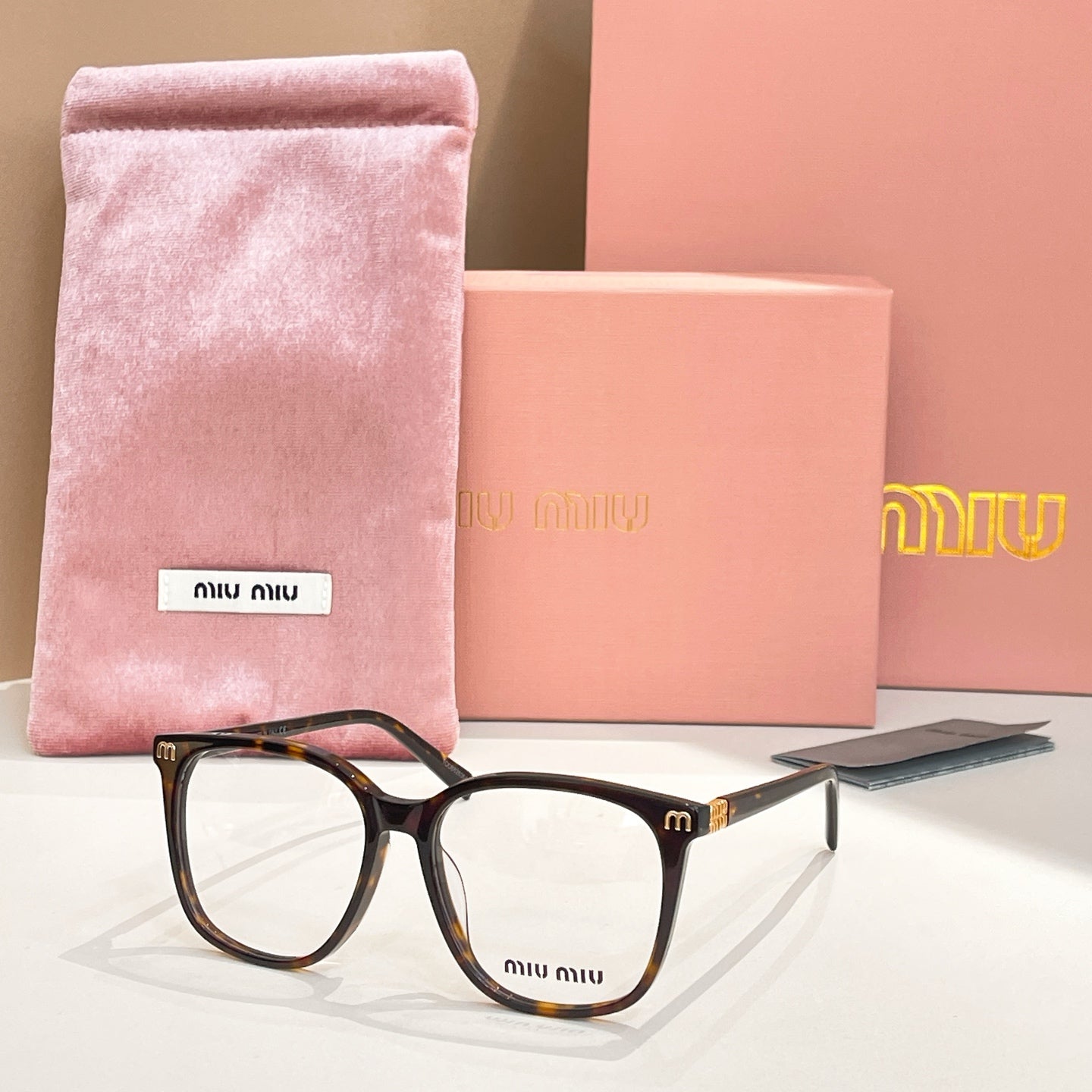Tortoiseshell full-rim eyeglasses with pink velvet pouch and case
